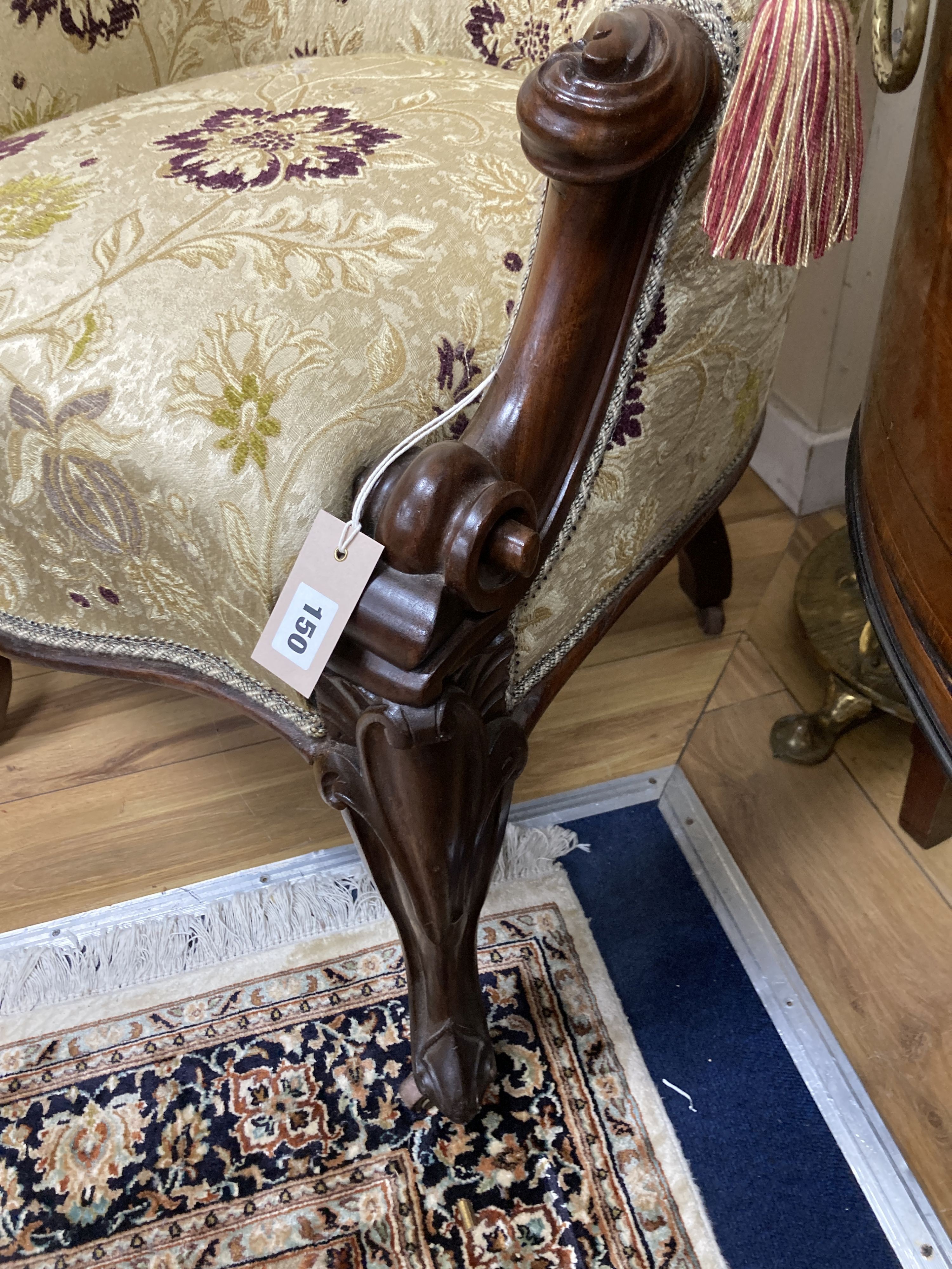 A Victorian upholstered carved mahogany tub chair. W-64, H-86cm.